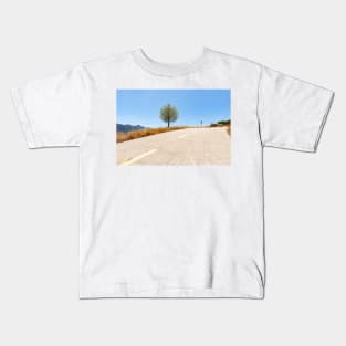 Road through Coll de rates uphill into mountains Kids T-Shirt